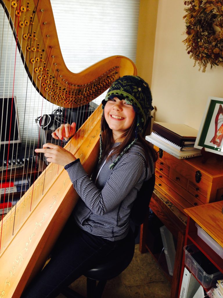 Hannah McCardle playing the pedal harp