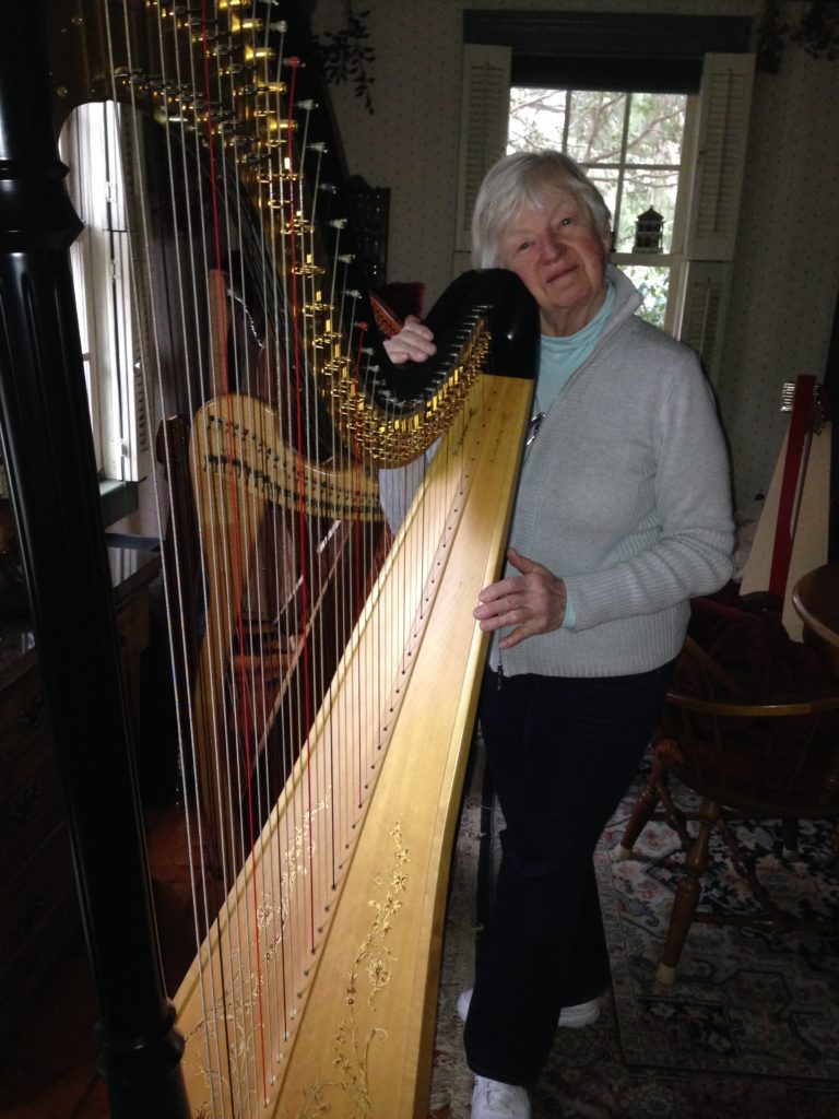 Joann Ryan with her pedal harp.